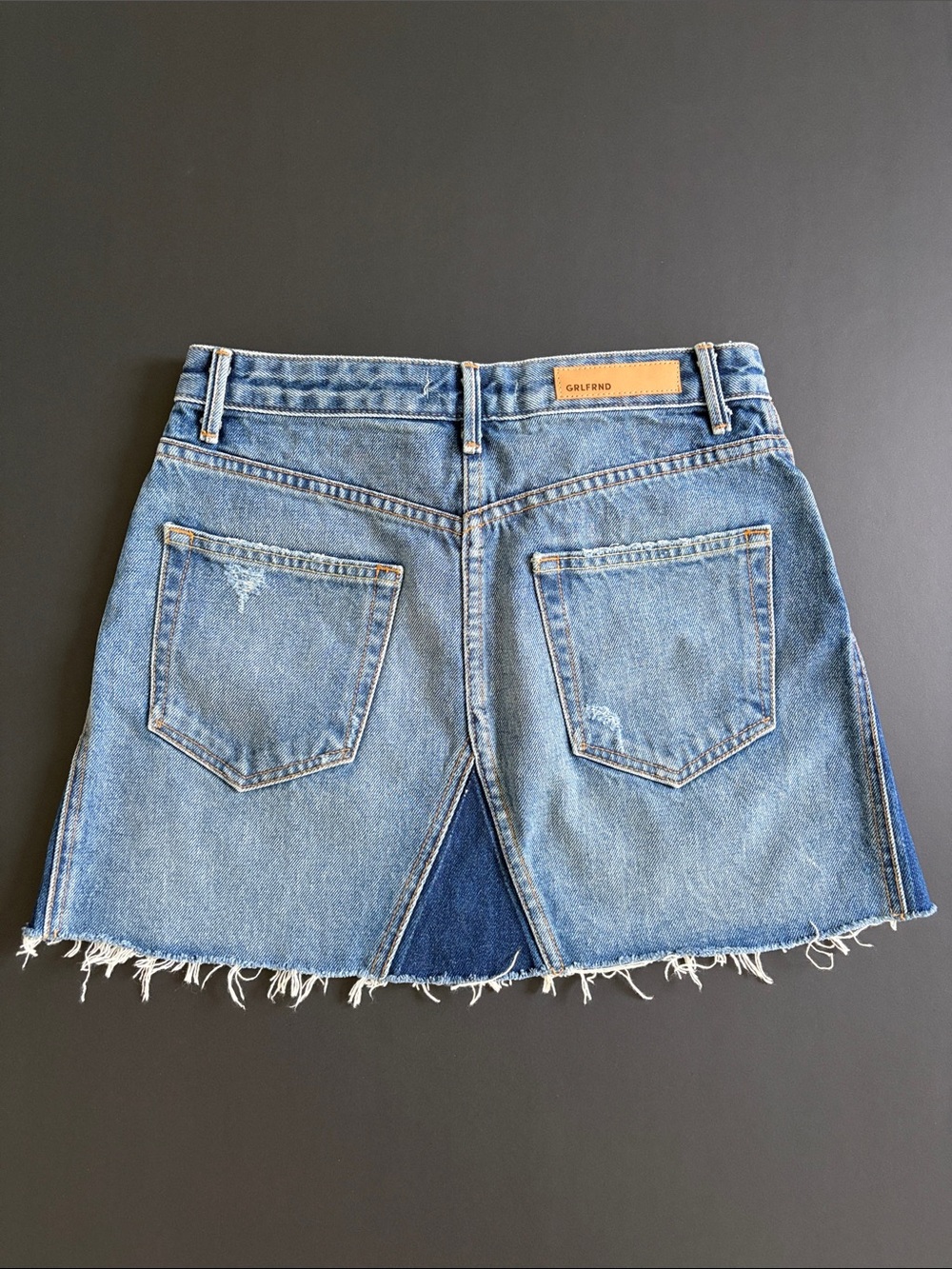 GRLFRND Two-Tone Blue Denim Mini Skirt with Frayed Hem